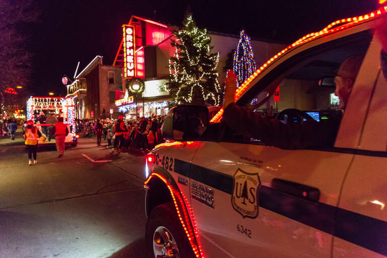 Smokey Bear joined Coconino National Forest employees and family members on our parade float at the Flagstaff Holiday of Lights, December 9, 2017. The crew decorated Engine 481 and the 1925 Dodge Brothers truck with holiday lights at the Flagstaff