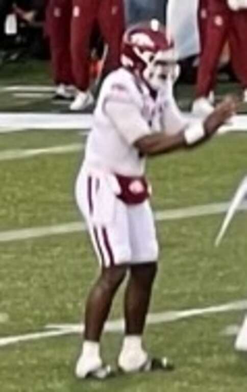 The Arkansas offense (white) lines up at scrimmage with the Kansas defense (blue) during the first quarter of the 2022 Liberty Bowl, played at Simmons Bank Liberty Stadium in Memphis, Tennessee.
