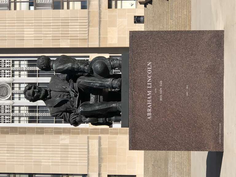 This is a photo of a statue depicting Abraham Lincoln and his son Tad. It is located on the south side of City Hall in Kansas City, Missouri.