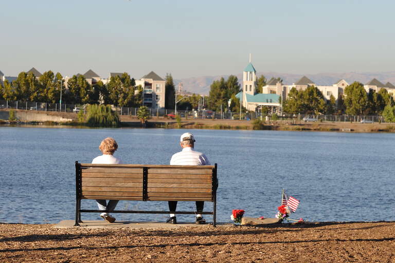 A couple enjoying the view of Almaden Lake