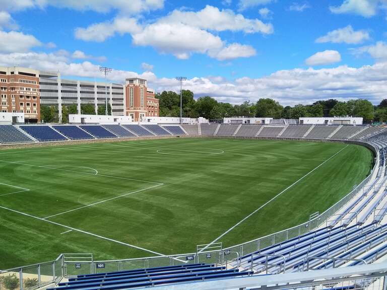 American Legion Memorial Stadium in May 2021. CPCC's parking garage is visible in the background.