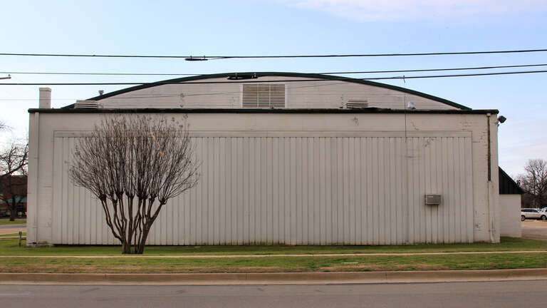 North side of the old Burleson Gymnasium in Burleson, Texas, United States.