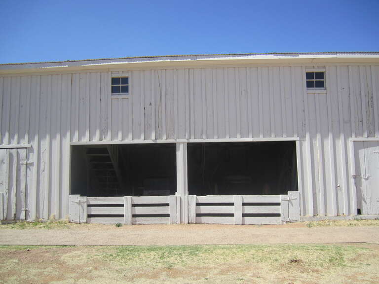 John B. Slaughter's carriage house moved from the U Lazy S Ranch southwest of Post, Texas, to the National Ranching Heritage Center in Lubbock, Texas.