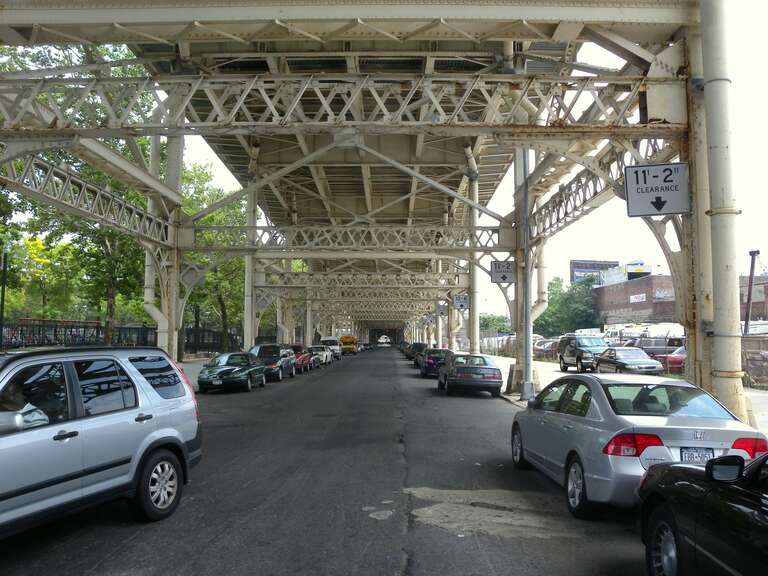 Looking east from Bradford Avenue, under the viaduct shown in File:Top 155 St Causeway jeh.JPG on a mostly cloudy midday.