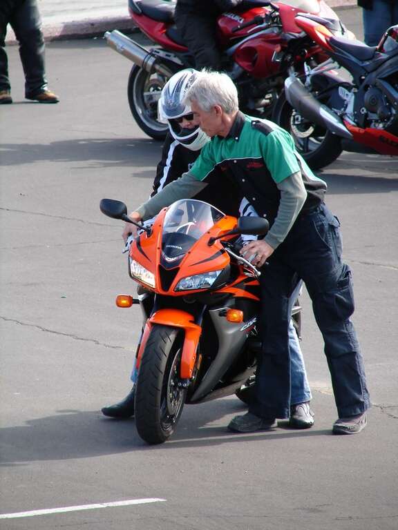 Keith Code at California Superbike School at controls of Honda CBR600RR with rider