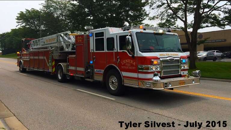 Lenexa, Kansas Fire Department's Ladder 91 a 2012 Pierce Velocity PUC Tiller 100' Ladder Responding (Picture is a screenshot from a Video) Picture ID# 9816