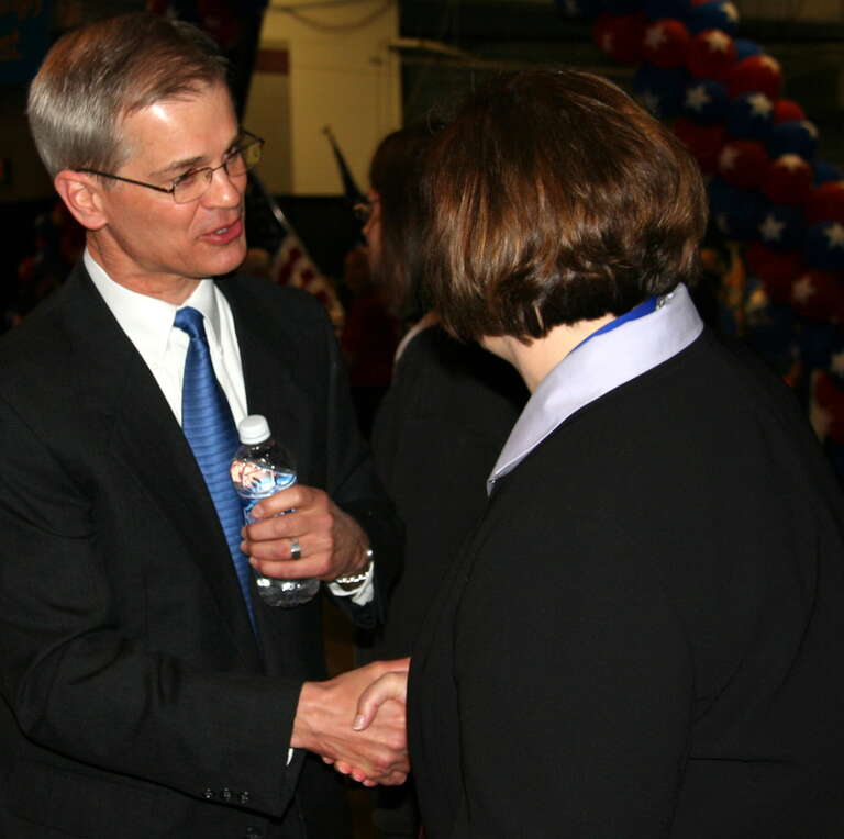 Minnesota State Senator John Marty (left) shaking hands with House Speaker Margaret Anderson Kelliher at the DFL 2010 State Convention in Duluth, Minnesota