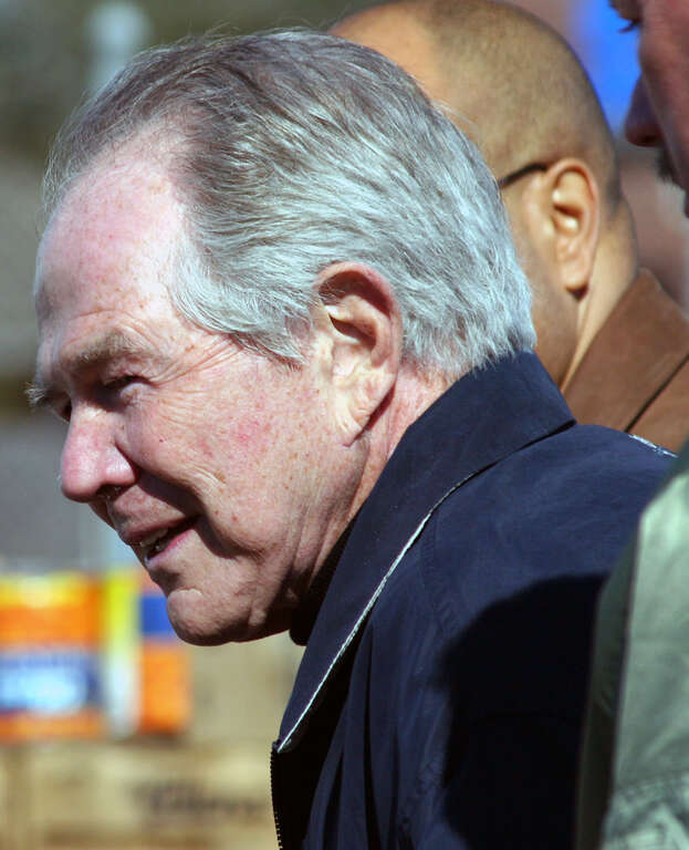 Paparazzo Presents a photo of televangelist Pat Robertson taken during his February 12, 2006 Operation Blessing visit to Victory Fellowship Church in Metairie, Louisiana.