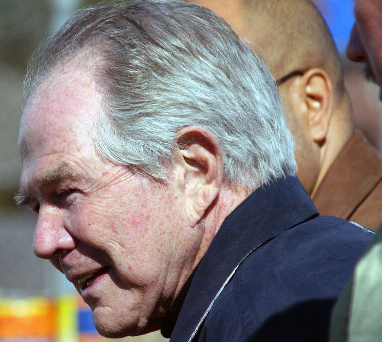 Paparazzo Presents a photo of televangelist Pat Robertson taken during his February 12, 2006 Operation Blessing visit to Victory Fellowship Church in Metairie, Louisiana.