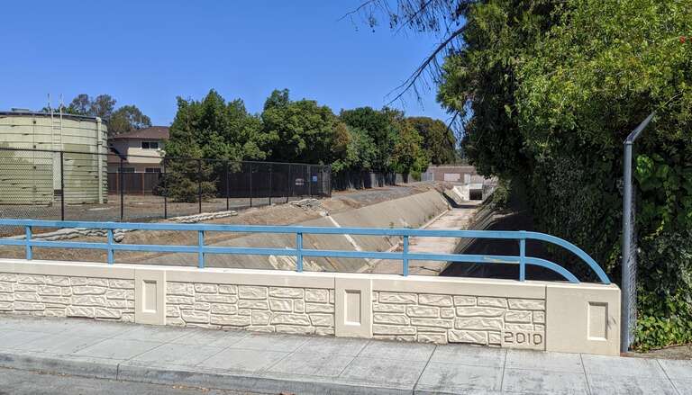 View looking east into Permanente Creek Diversion Channel as it approaches the box culvert under Highway 85