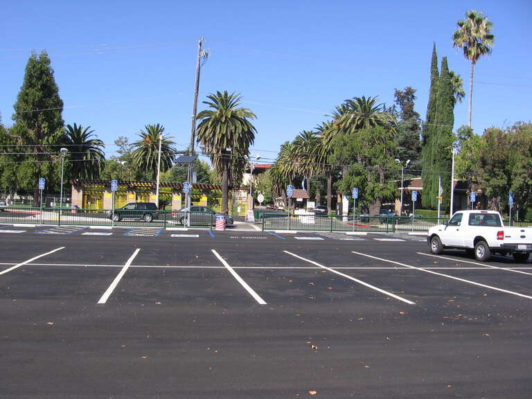 The Pleasanton (ACE station) in Pleasanton, California, USA.  The main entrance gate to the Alameda County Fairgrounds is visible across the street from this photo taken from the station platform.