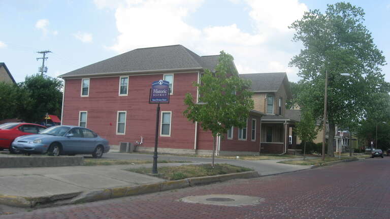 Houses on the northern side of the 100 block of E. State Street in Elkhart, Indiana, United States.  This block is part of the State Street-Division Street Historic District, a historic district that is listed in the National Register of Historic