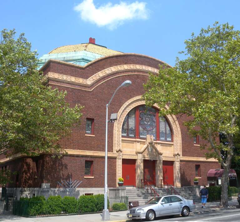 Looking northwest across JFK Boulevard and Harrison Avenue at Temple Bethel on a sunny midday.