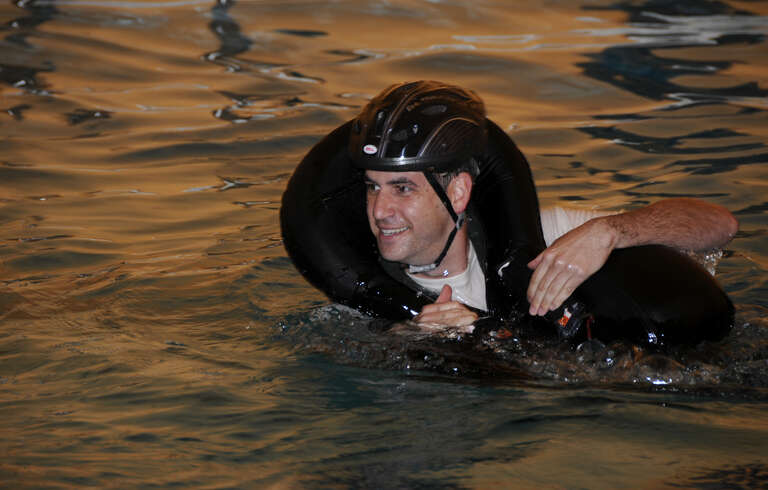 Specialists with the 188th Operations Group’s Life Support Element administer water survival training to pilots with the 184th Fighter Squadron of the 188th Fighter Wing at Creekmore Park in Fort Smith, Ark., March 4, 2012. The training is required