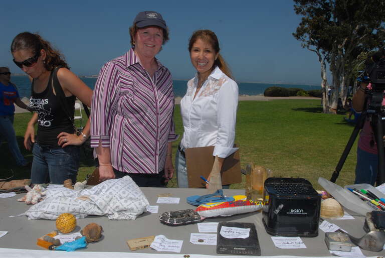 Chula Vista Mayor Cheryl Cox and Port Commissioner Ann Moore review the entries for the &quot;Most Unusual Trash&quot; contest at the Operation Clean Sweep barbecue. (Photos by Dale Frost/Port of San Diego.)