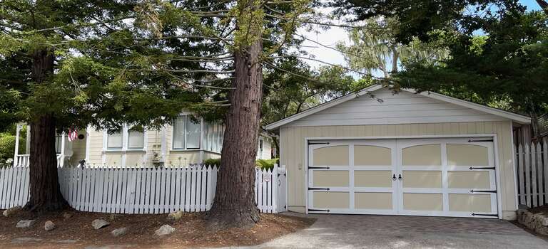The Abbie Jane Hunter House is a historic one-and-one-half story wood-framed Queen Anne style residence, located on the northeast corner of 4th Avenue and Guadalupe Street in Carmel-by-the-Sea. The house was designed by Douglas Knox Friser and built