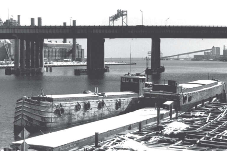 Three barges in the harbor of Bridgeport, Connecticut, in 1973.  All three sank in 1974.  At the rear right is the Elmer S. Dailey, at the front is the Priscilla Dailey, with the Berkshire No. 7 next to it.