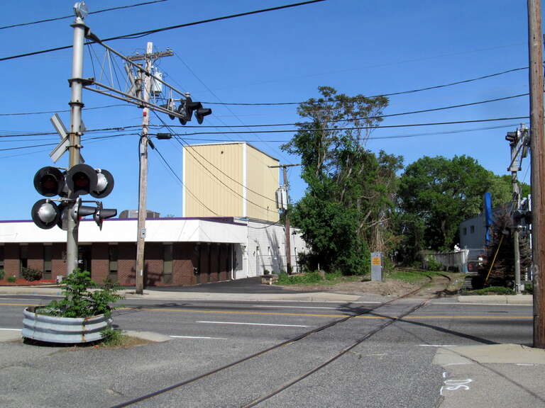 Buttonwoods Branch crossing of Elmwood Avenue (US 1) in Cranston, Rhode Island in May 2017, shortly after part of the line was cleared for brush for a possible reopening