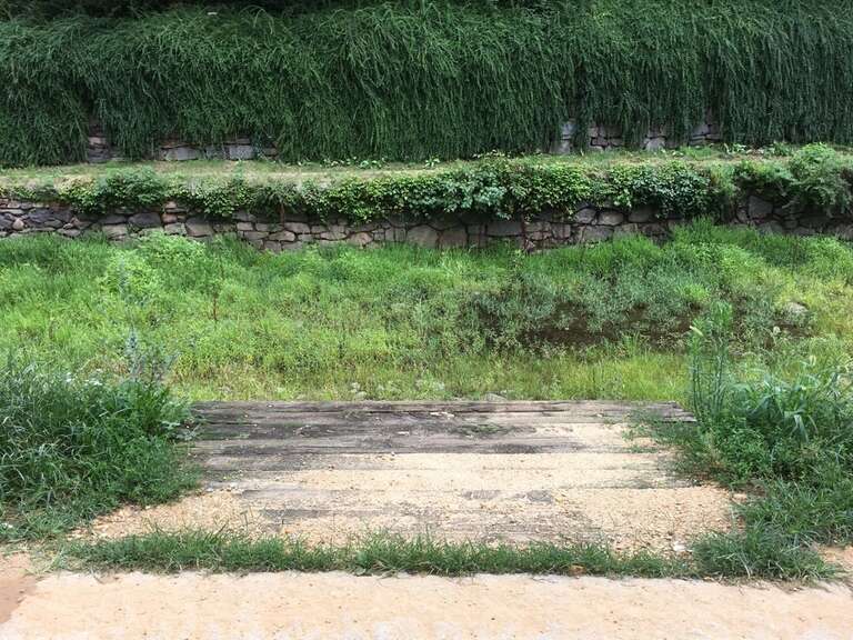 A paved path leads to the edge of the green canal
C &amp;amp; O Canal Intake
Keywords: national park service; nps; choh; chesapeake &amp;amp; ohio canal; c &amp;amp; o canal