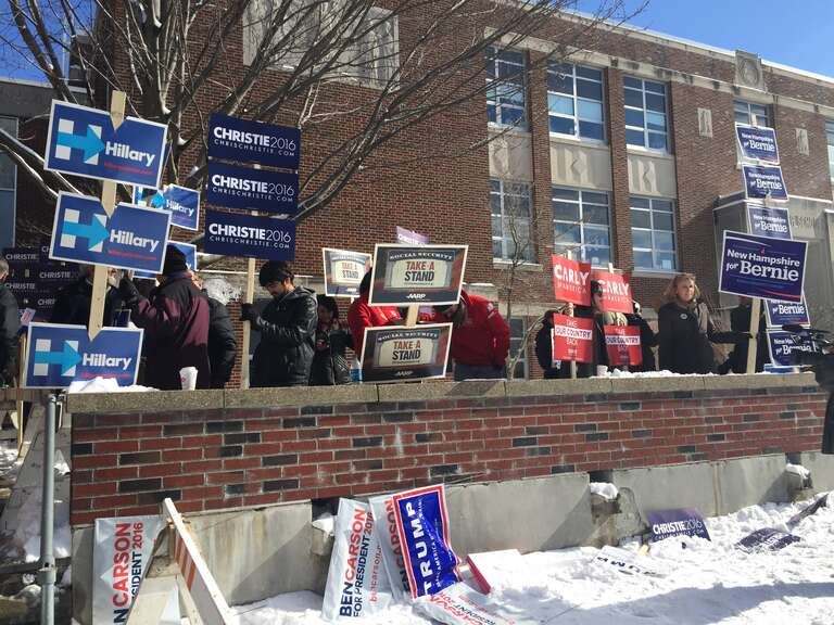 Candidates' posters on display in front of a polling station in Ward 1, Manchester, New Hampshire, Feb. 9, 2016. (Photo: K. Gypson / VOA)