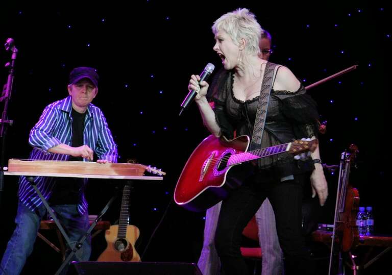 Cyndi Lauper performed on the R Family Vacations cruise. The organizers made sure that the crew was able to attend the concert as well. Cyndi's sister is in the background.