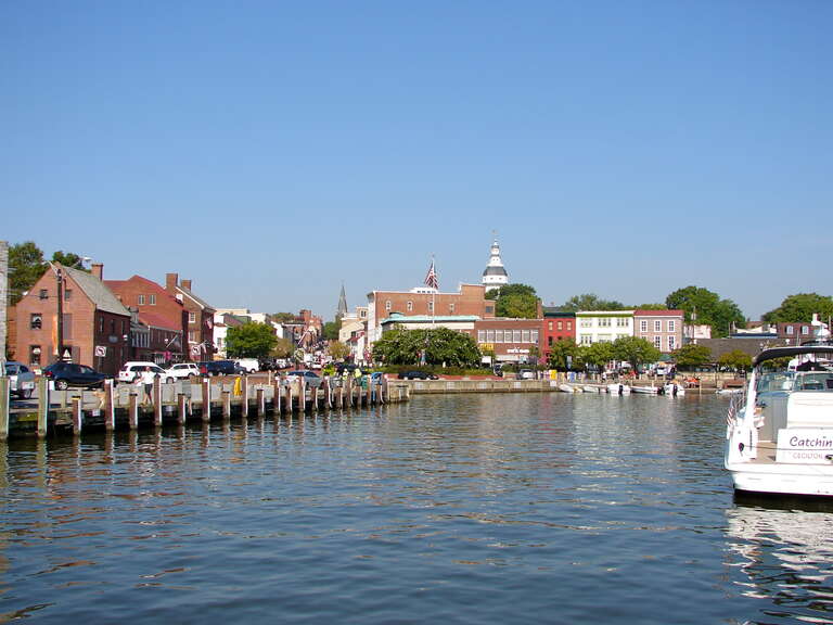 The dock or harbor in Annapolis, Maryland.  Dock Street is just out of the frame of the photo to the right.  Folks leaving their boats tied up here would step right out into the street.  The Maryland State Capitol is the tall tower in the distance.