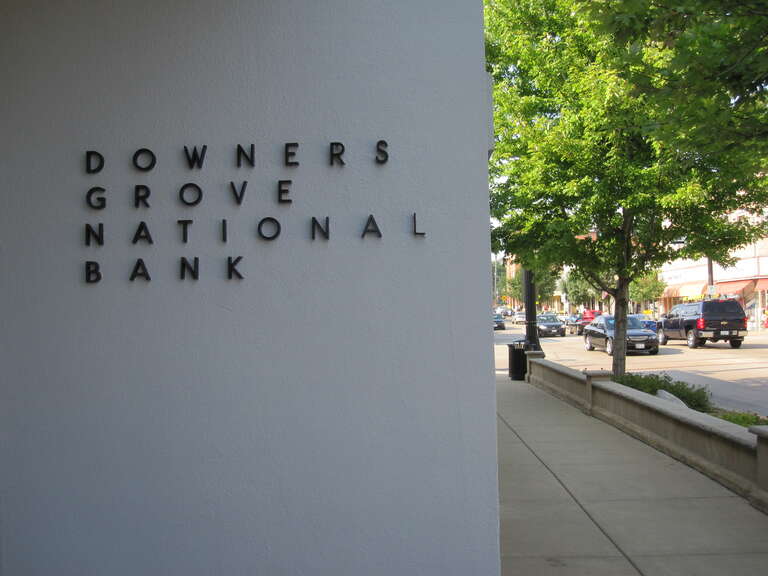 South wall of the east entrance of Downers Grove National Bank, 5140 Main Street, Downers Grove, Illinois.  Looking NNE towards the opposite side of the next block north on Main Street.  August 2009.  A year after this photo, the bank was bought by