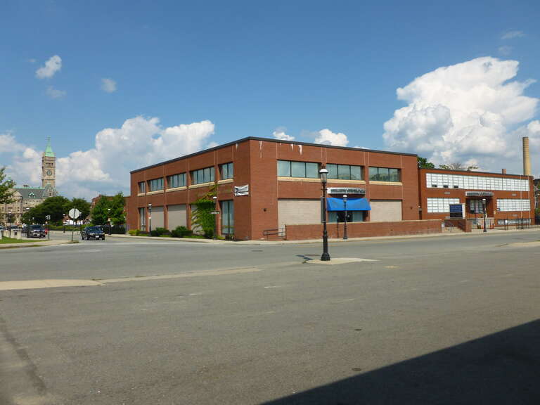The Hellenic Cultural Center and Hellenic American Academy, located at 41 Broadway Street, Lowell, Massachusetts.  Northeast and southeast (front) sides shown.  Lowell City Hall is visible in the background at left.