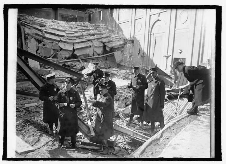 Officers inspect the scene of the Knickerbocker Theater disaster.