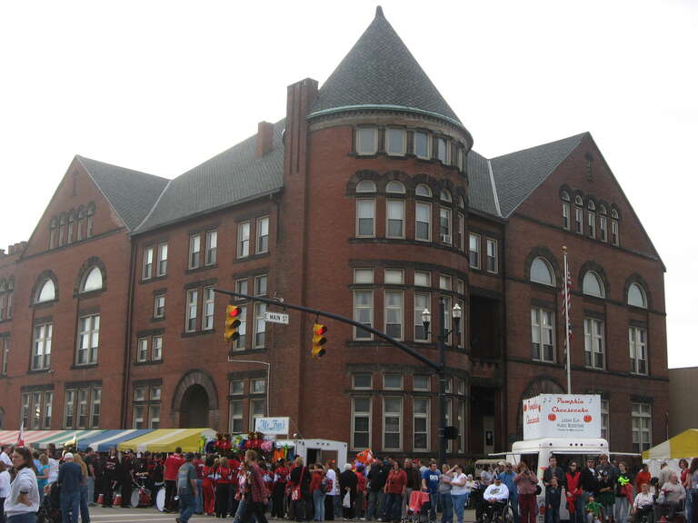 Northern and eastern sides of Memorial Hall, located at 165 E. Main Street in Circleville, Ohio, United States.  Built in 1891, the hall is listed on the National Register of Historic Places.  Photo is taken during the Circleville Pumpkin Show, which
