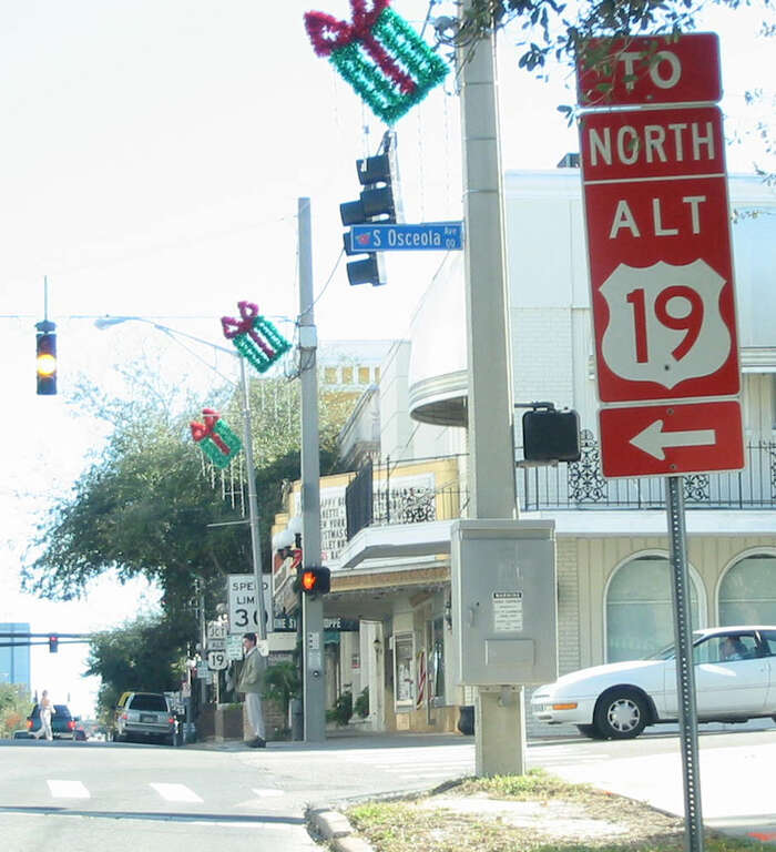 Red US 19 Alternate shield in Clearwater, Florida. View from the intersection of Cleveland Street and S. Osceola Avenue, looking east along Cleveland Street.