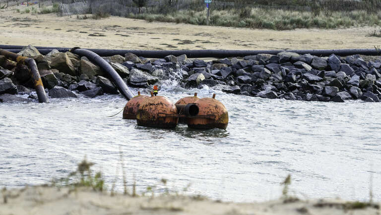 Rudee Inlet pontoon during a stormy and windy day.
