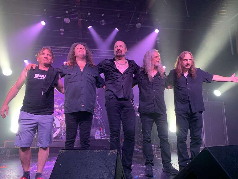 Symphony X take a bow after performing in Carrboro, North Carolina, in 2022. From left to right: Jason Rullo, Michael Romeo, Russell Allen, Michael Pinnella and Michael LePond