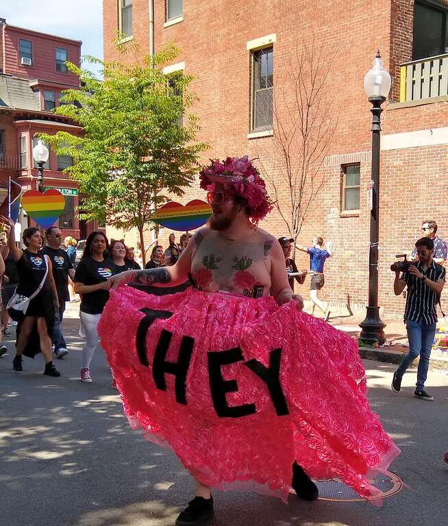 Proponent of pronoun &quot;they&quot; representing someone who doesn’t identify with either gender at the Boston Pride parade.