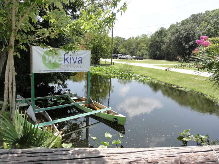 Playing Kayak at Wekiva. A view of the Wekiva River Canoe Trail in Florida.  Sign displaying Wekiva Island.