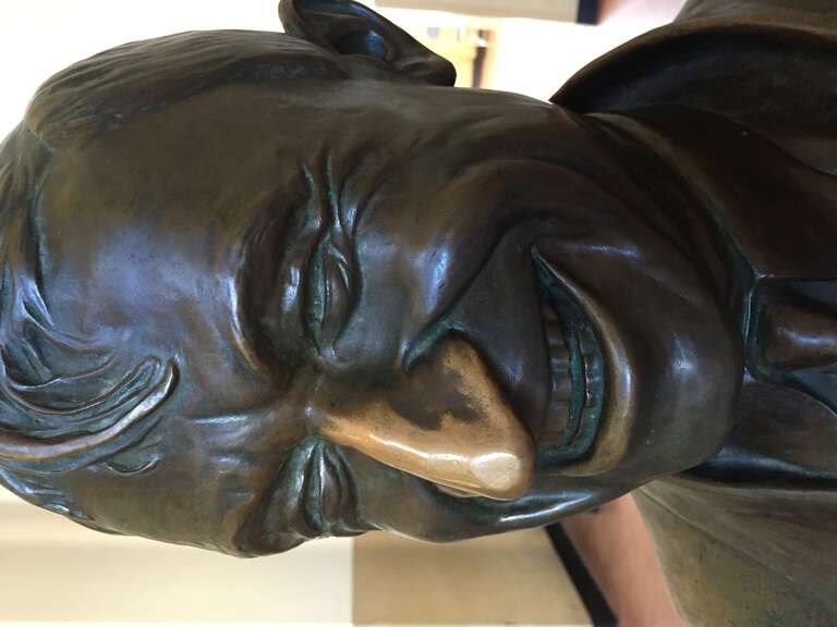A bronze bust of Will Rogers found in the rotunda of the Will Rogers Memorial Center in Fort Worth, Texas, United States. Visitors rub the nose for good luck, causing the discoloration seen here.