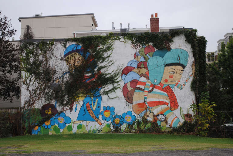 500px provided description: As Autumn progresses nature retreats and slowly uncovers a beautiful graffiti in Washington DC (Oct 2017) [#city ,#urban ,#graffiti ,#street art ,#United States ,#Washington DC]