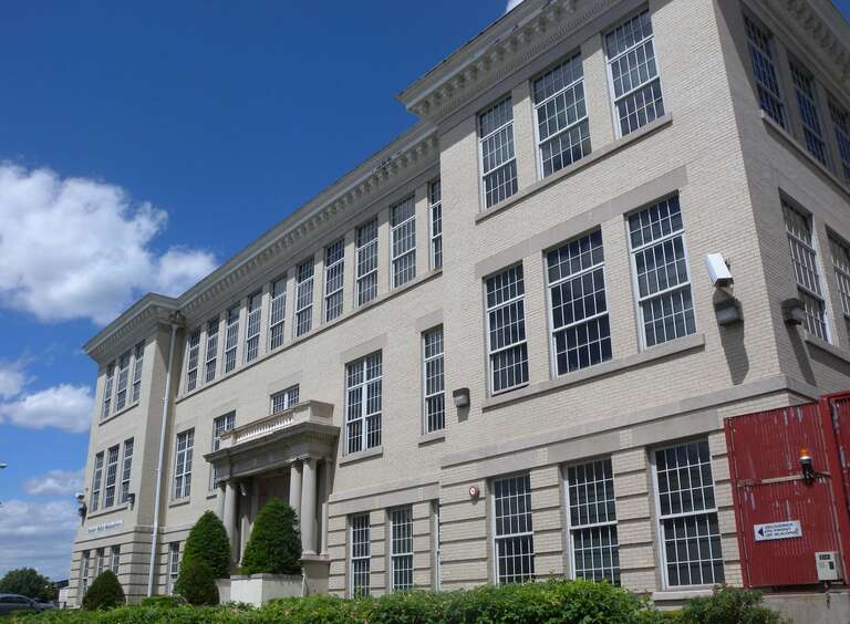 Looking north from South Broadway at Police headquarters on a sunny early afternoon.