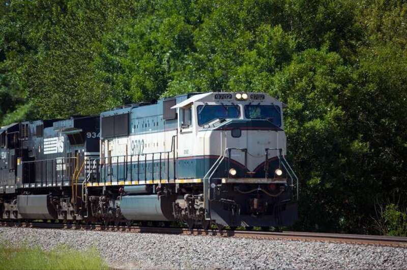 BNSF (Burlington Northern Santa Fe) Locomotive #9702, sporting the Executive Paint Scheme, leads an eastbound freight bound for Fort Scott, KS through Claremore, OK.