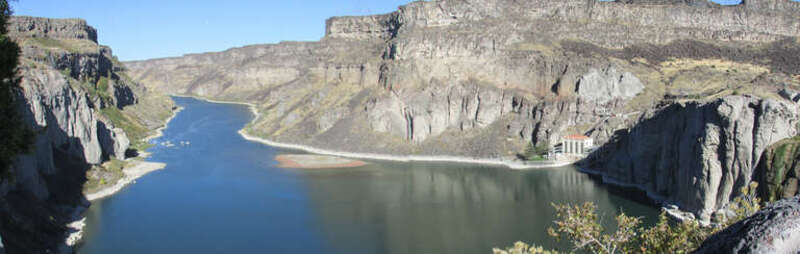 Snake River Canyon below Shoshone Falls is 460 ft deep and just over a mile and a quarter to the bend.