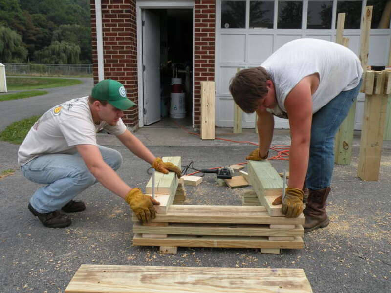 YCC crew members build benches at White Sulfur Springs National Fish Hatchery.
