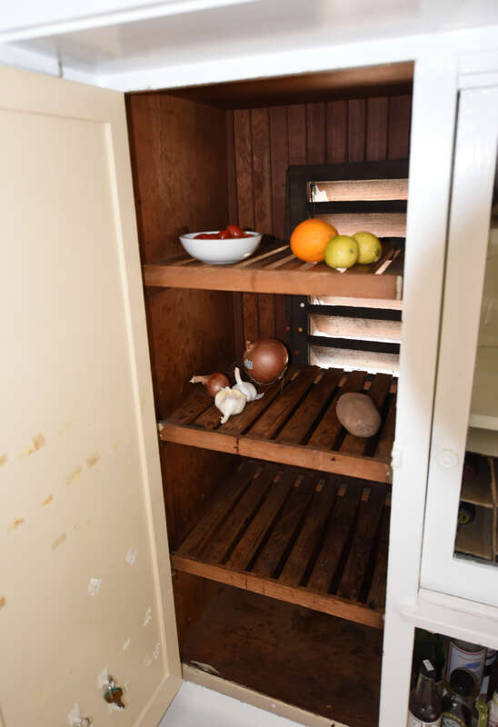 This is an interior photograph of a California Cooler with the door open. It is used to store perishable food items.