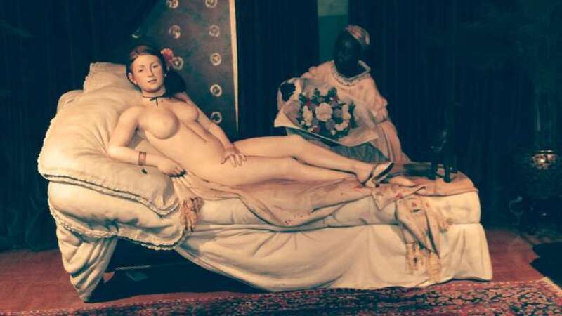 This is Seward Johnson's full-size reconstruction of Edouard Manet's painting &quot;Olympia&quot;, which is in the Musee d'Orsay. It is most striking -- one steps through a door into a full-size bedroom, with the prostitute Olympia and her servant (and cat)