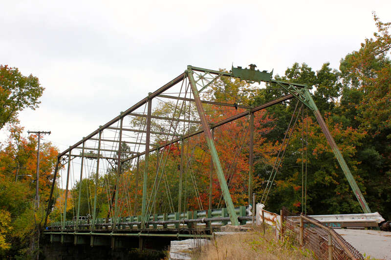 Bridge carrying Leveilee Street over the Pawtuxet River.  It is not the Interlaken Mill Bridge, which is not on a public roadway, and has a lenticular (lens-shaped) truss.