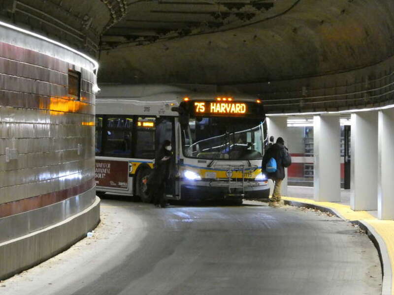 Passengers getting off a MBTA route 75 bus in the Harvard Bus Tunnel in March 2022