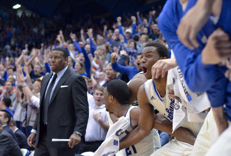 500px provided description: Freshman forward Andrew Wiggins and the Kansas bench react to senior forward Tarik Black's dunk over a Texas defender midway through the second half of the game. Kansas defeated Texas 85-54 on Feb. 22 in Lawrence.