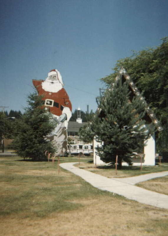 Santa greets one in summer in Christmas Tree town of Shelton, WA. 1988.