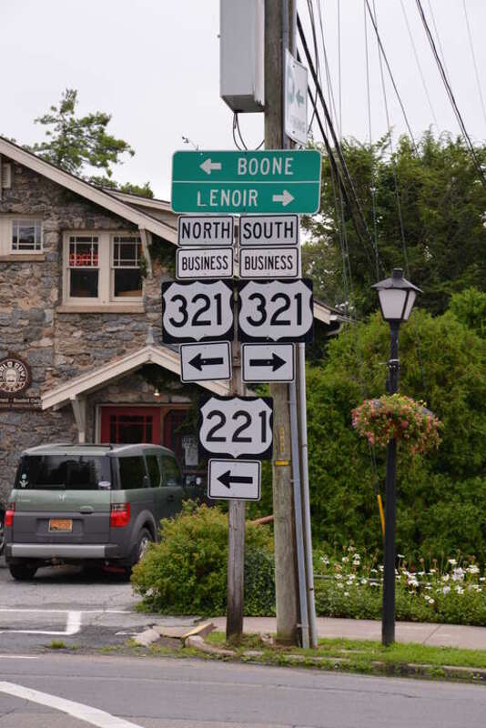 Directional signs in downtown Blowing Rock for US 221 and US 321 Business.
