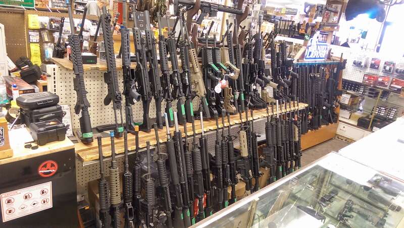 A rack of various assault rifles, mostly AR-15's, in Gallenson's Gun Shop, located in Salt Lake City, Utah, USA.