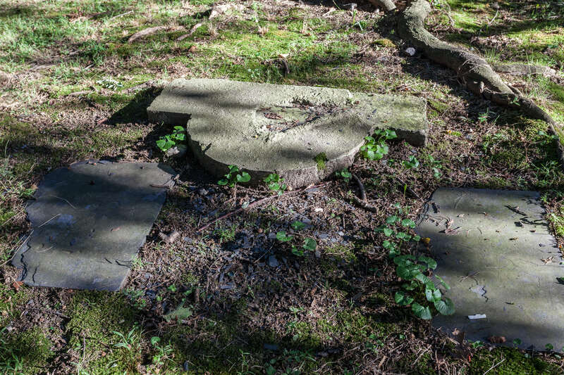 Closeup of concrete base where statue once stood. Constance Witherby Park, 210 Pitman St.